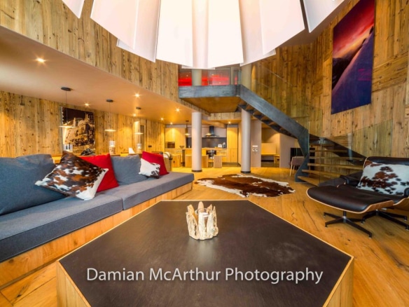 Interior of a modern loft with spacious living room, wood and contemporary design in Avoriaz.