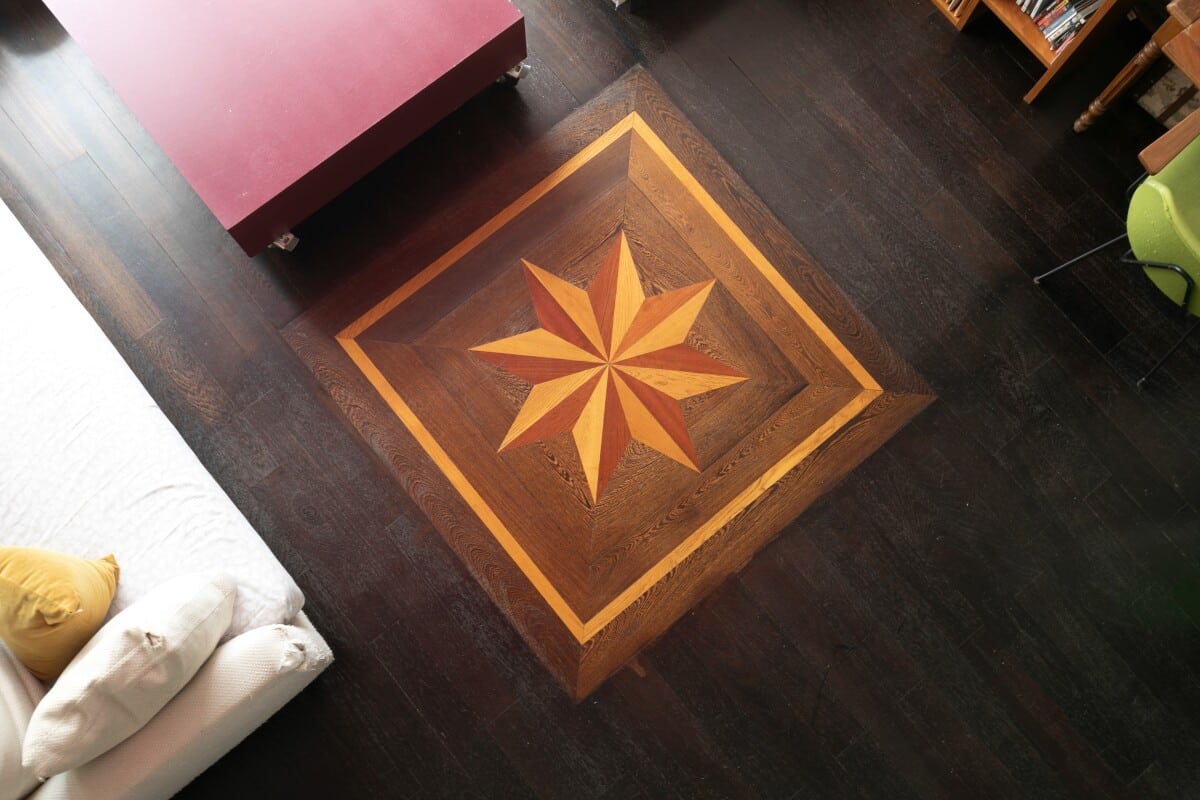 Artist's studio in Paris View of the wooden floor with a geometric star pattern in an artist's studio in Paris.