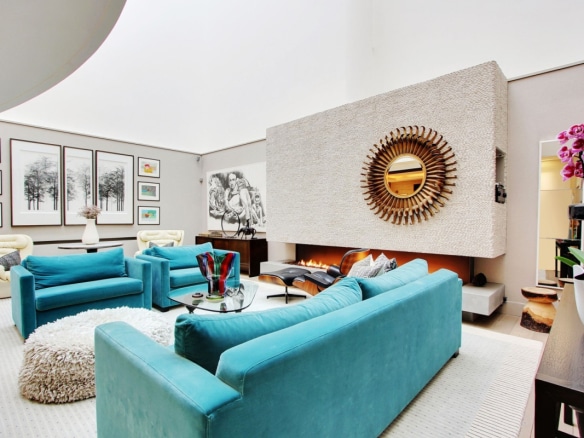 Interior of a private mansion in Paris 7, with an elegant living room and a modern fireplace.