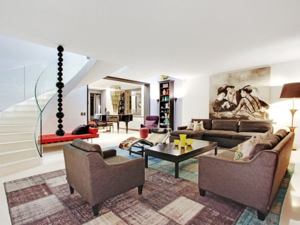 Interior of a private mansion in Paris 7, spacious living room with modern furniture and works of art.