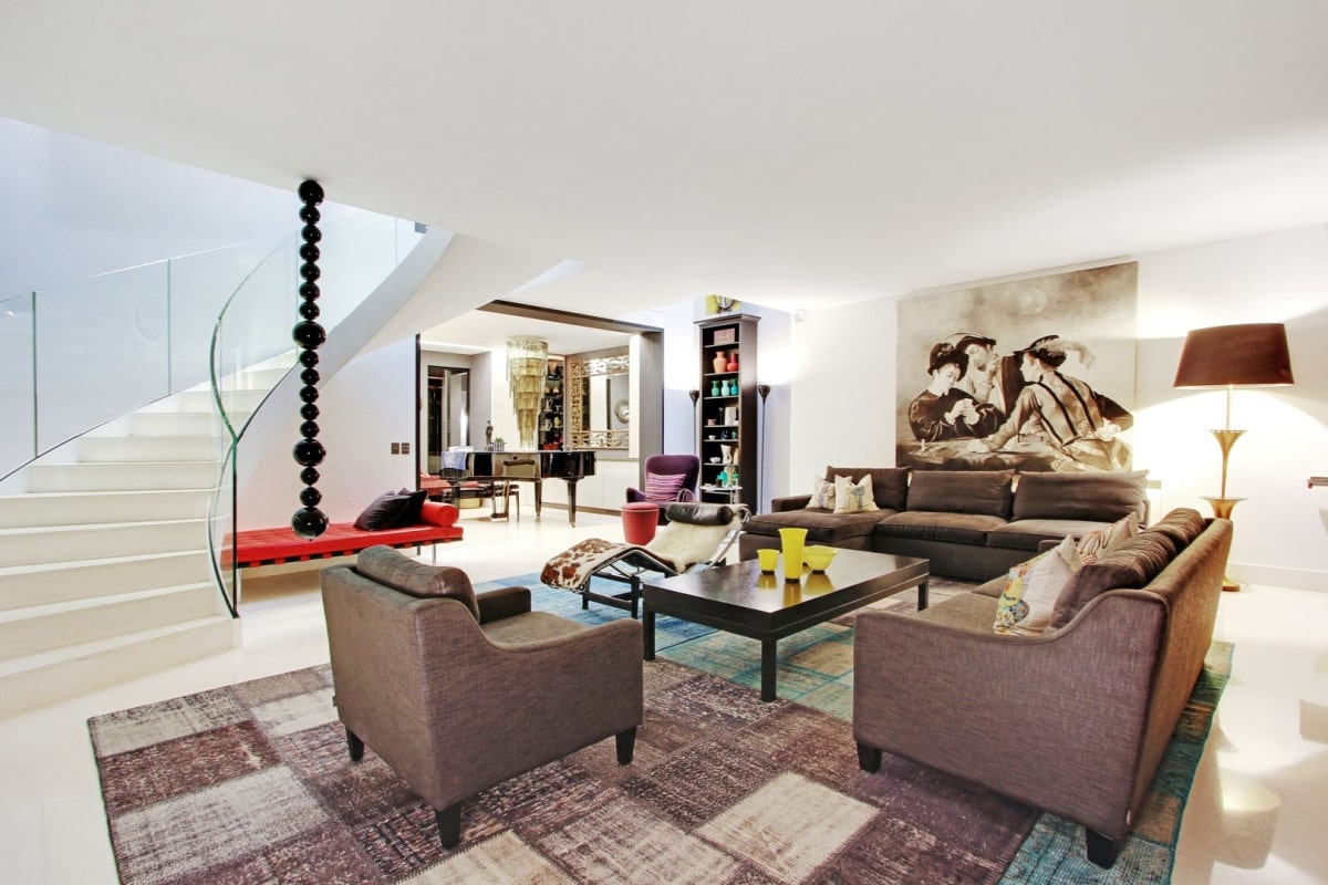 Interior of a private mansion in Paris 7, spacious living room with modern furniture and works of art.