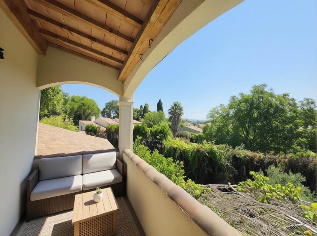 Terrace with a view in Paradou Terrace of a house overlooking gardens and trees in Paradou.