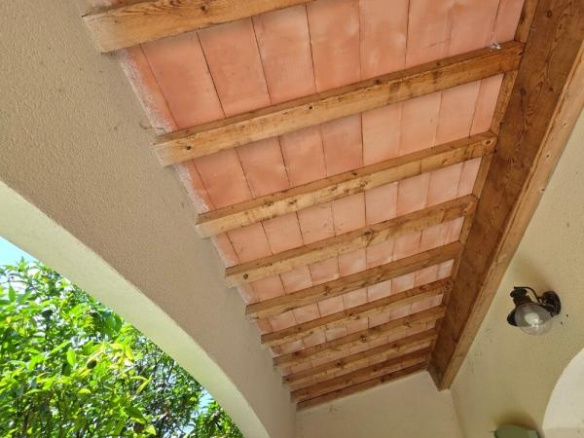 Wooden ceiling of an entrance porch of a house in Paradou.