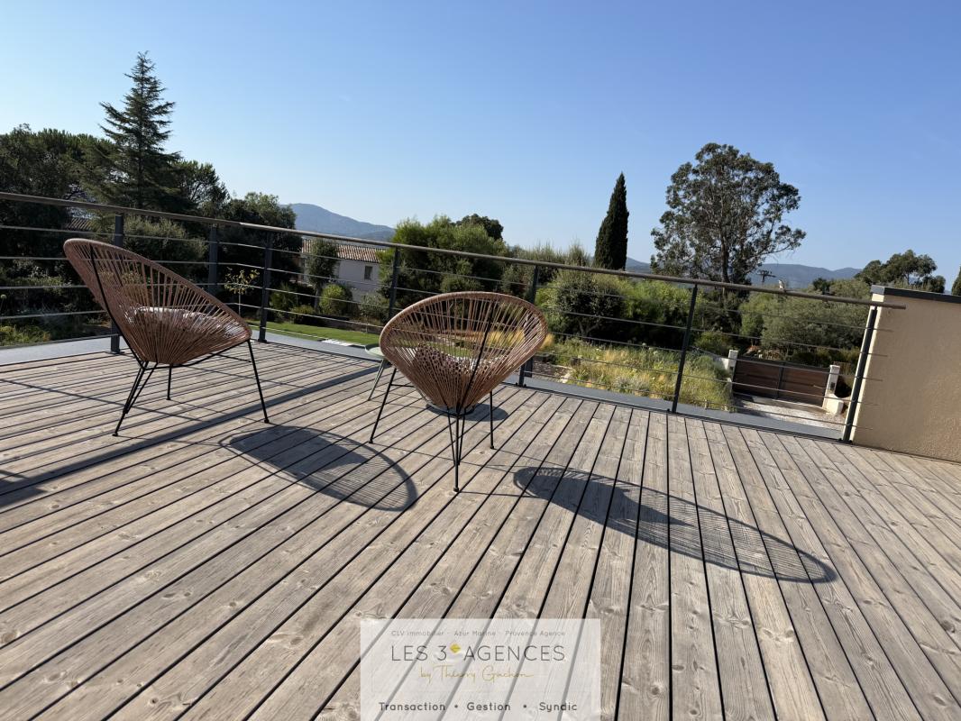Villa terrace in Grimaud Wooden terrace with chairs in the sun, overlooking nature in Grimaud.