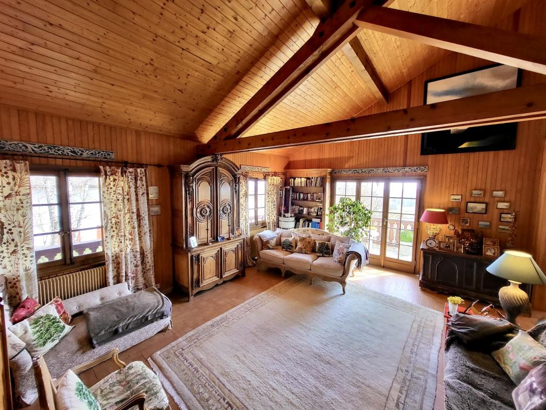 Interior of a chalet in Grilly Interior of a large traditional chalet in Grilly with a bright living room and wooden furniture.