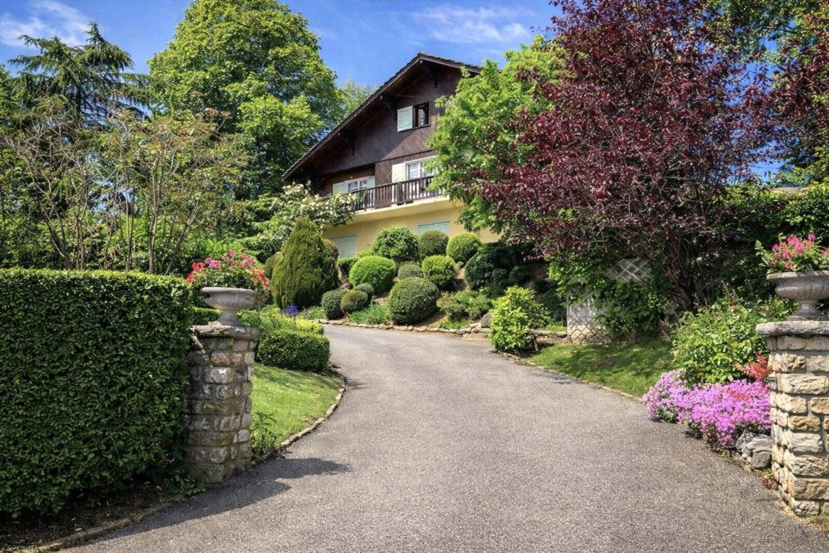 Traditional chalet in Grilly Large traditional chalet in Grilly with landscaped garden and access driveway.