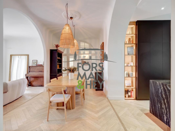 Interior of an elegant apartment with a bright dining room and living room in Grasse.