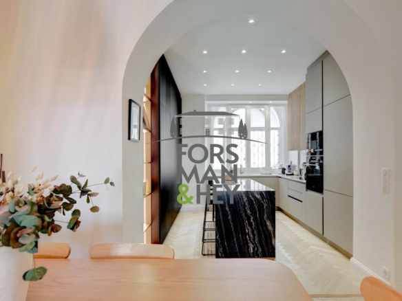 Interior of a contemporary apartment with open kitchen and dining room in Grasse.
