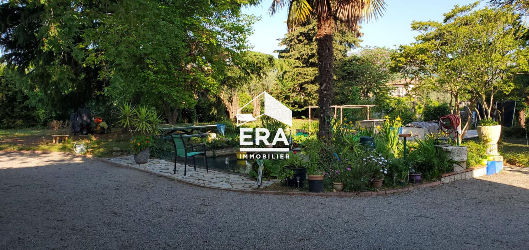 Garden of a house in La Gaude Garden of a house in La Gaude with garden furniture and lush vegetation.