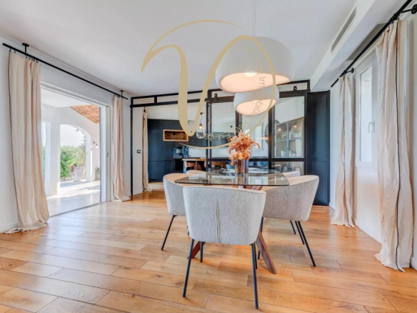 Interior of a modern villa with dining room and outdoor access, La Colle-sur-Loup.