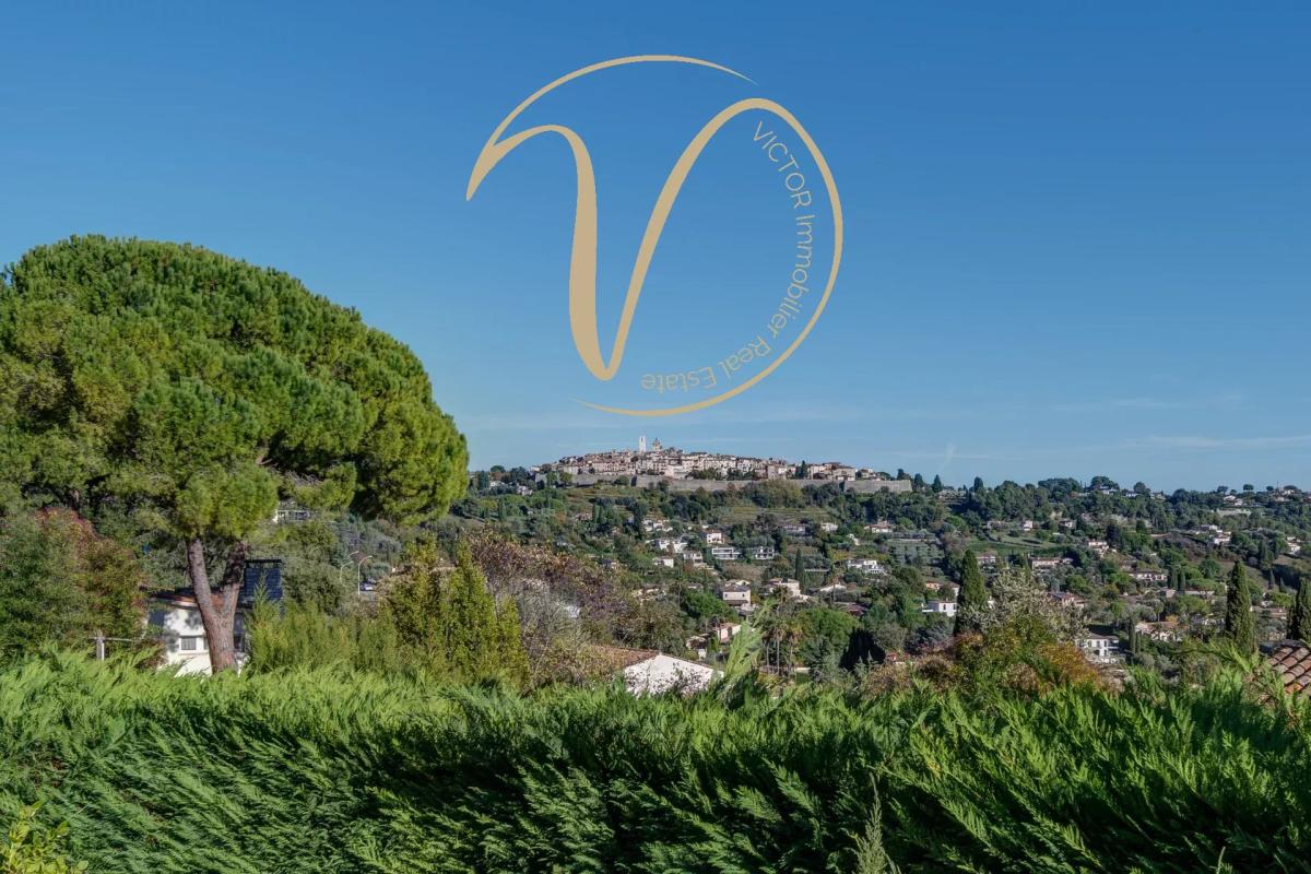 View of Saint Paul de Vence View of the villa of Saint Paul de Vence from La Colle-sur-Loup, with hills and trees in the foreground.