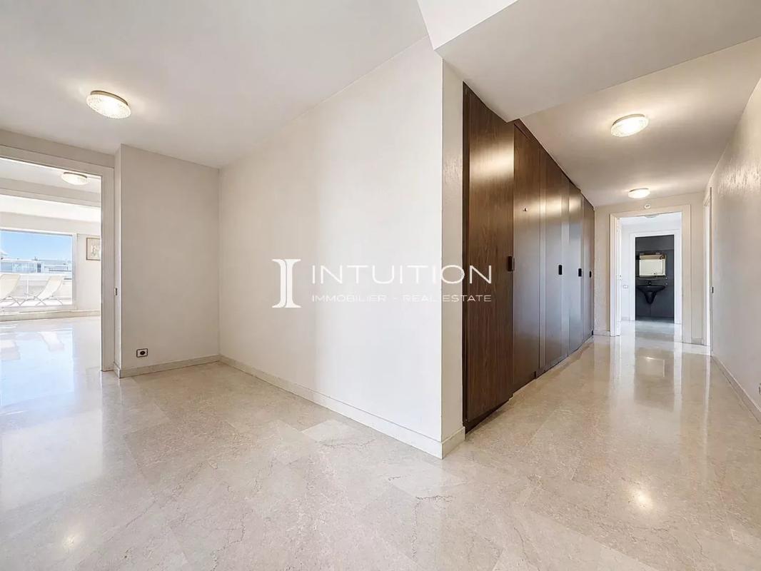 Interior of a spacious apartment with hallway and built-in closets in Cannes.