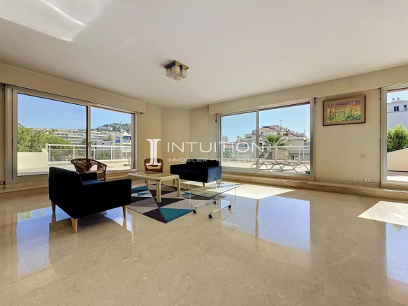 Bright interior of an apartment in Cannes with a view of the terrace.