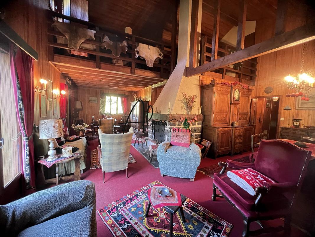 Interior of a chalet in the Aravis Interior of a family chalet with living room, fireplace and wooden furniture, Aravis area, La Clusaz.