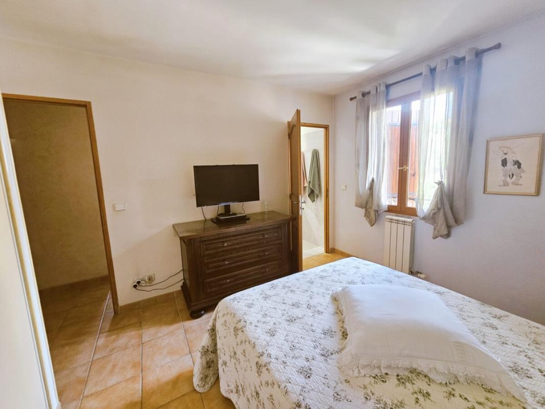 Room in a villa in Le Cannet with bed, television and window.