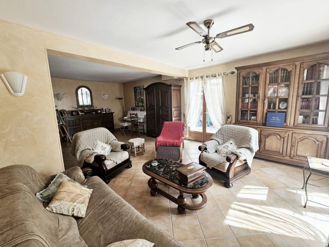 Interior of a family villa with a bright living room and traditional furniture.