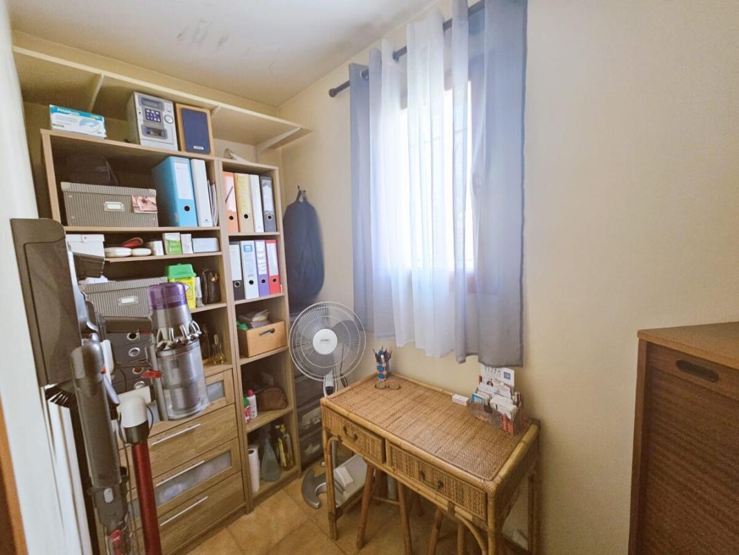 Interior of a storage room with shelves and wicker furniture.