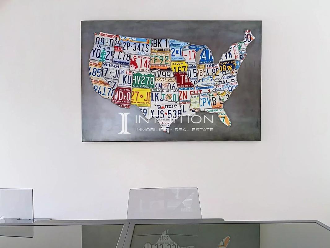 Interior decoration with a map of the United States Map of the United States made with license plates, hanging on the wall of an apartment.