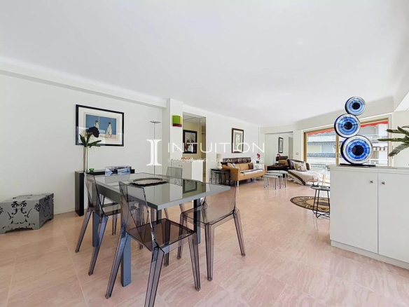 Interior of a modern apartment with a bright dining room and living room.