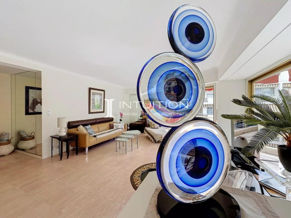 Interior of a modern apartment with contemporary decor and glass sculpture.