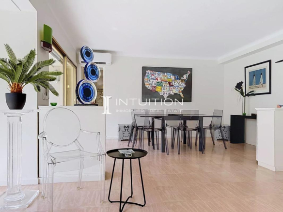 Interior of a modern apartment with a bright dining room and living room in Cannes.