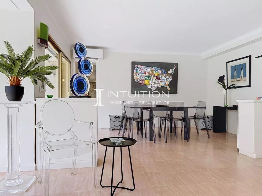 Modern apartment in Cannes Interior of a modern apartment with a bright dining room and living room in Cannes.