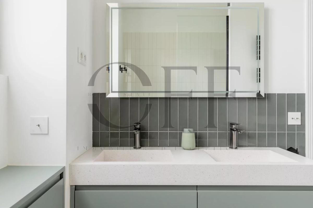 Modern bathroom Modern bathroom with double sink and mirror, grey and white walls.
