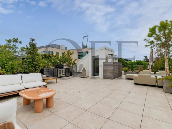 Landscaped terrace of a penthouse in Neuilly-sur-Seine with modern furniture.