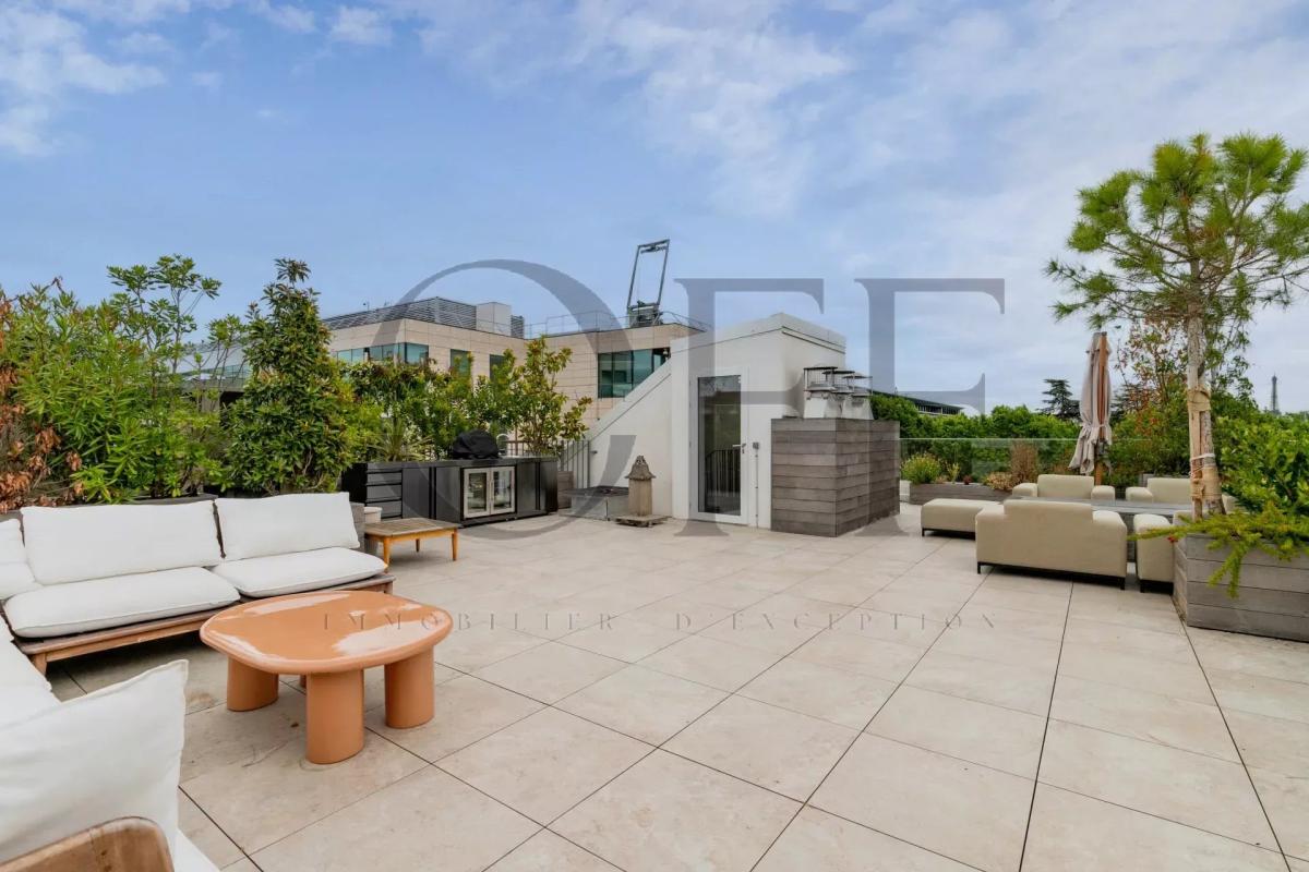 Terrace of a penthouse in Neuilly-sur-Seine Landscaped terrace of a penthouse in Neuilly-sur-Seine with modern furniture.
