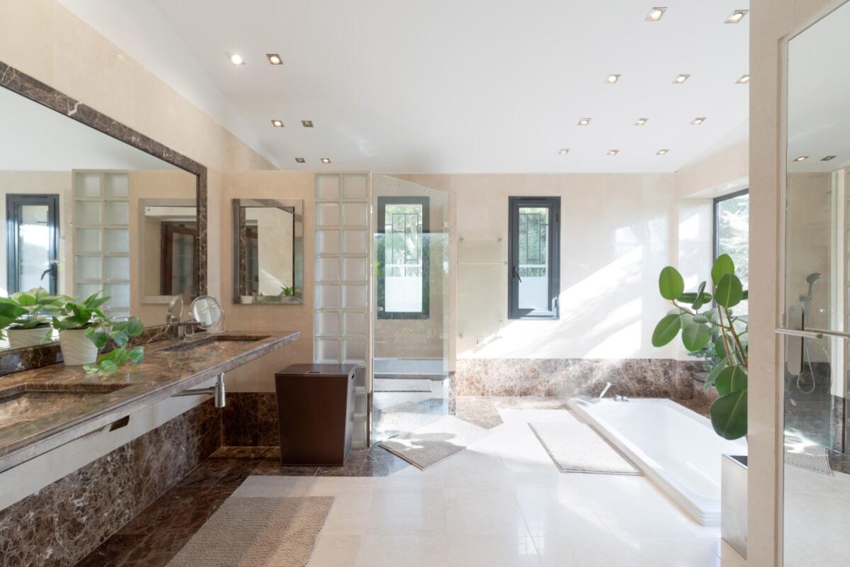 Modern bathroom in a villa in Biot Spacious bathroom with bathtub and large windows in a villa in Biot.