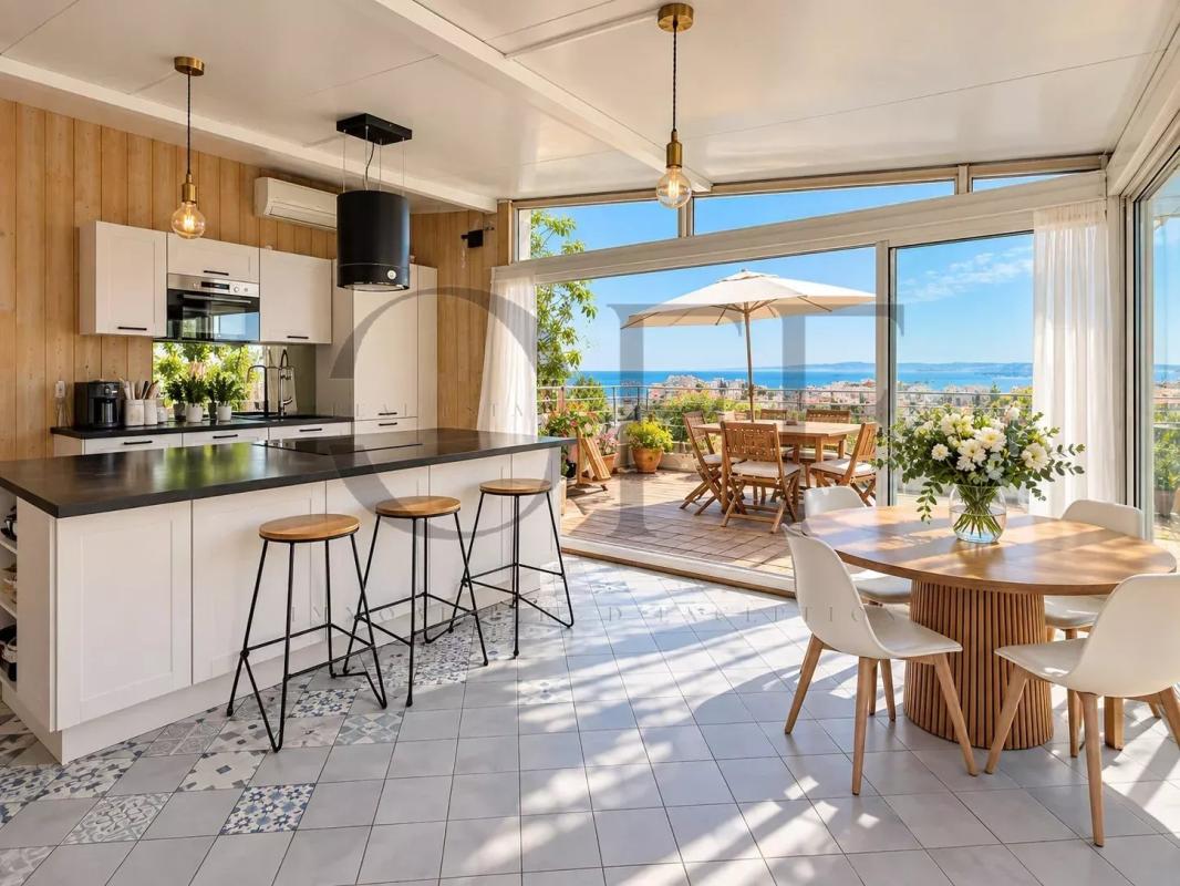 Exceptional duplex in Roucas-Blanc Interior of a duplex with modern kitchen and sea view in Marseille.