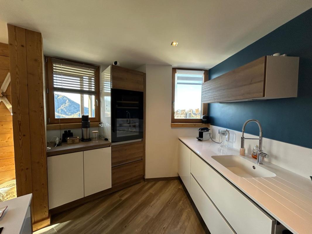 Kitchen of a duplex apartment in Morzine Modern kitchen in a duplex apartment with mountain views.