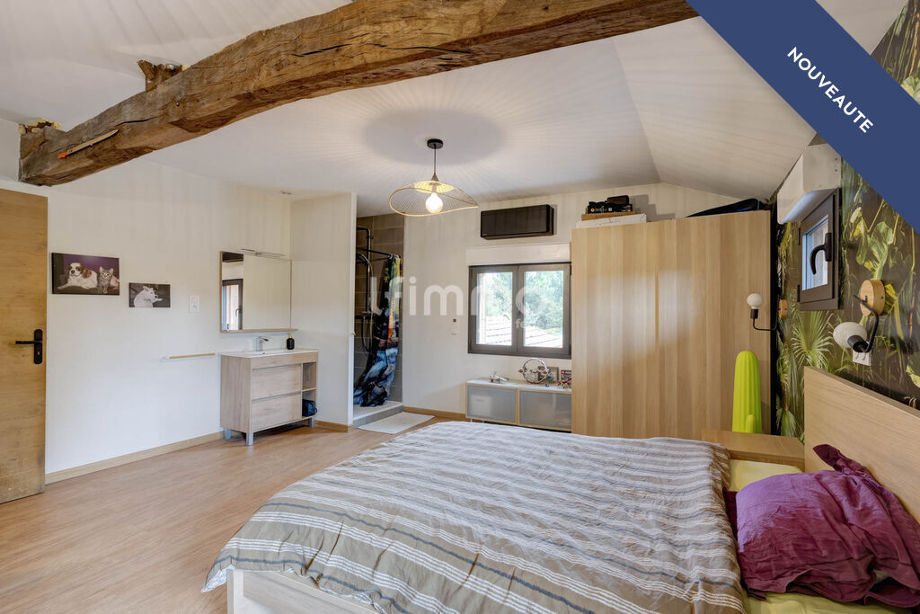 Modern bedroom with wooden elements Bedroom in a renovated property with wooden elements and a desk area.