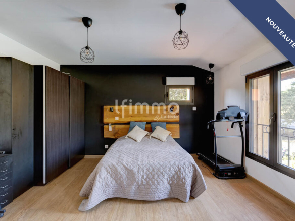 Modern room with double bed and contemporary decor in a renovated property.