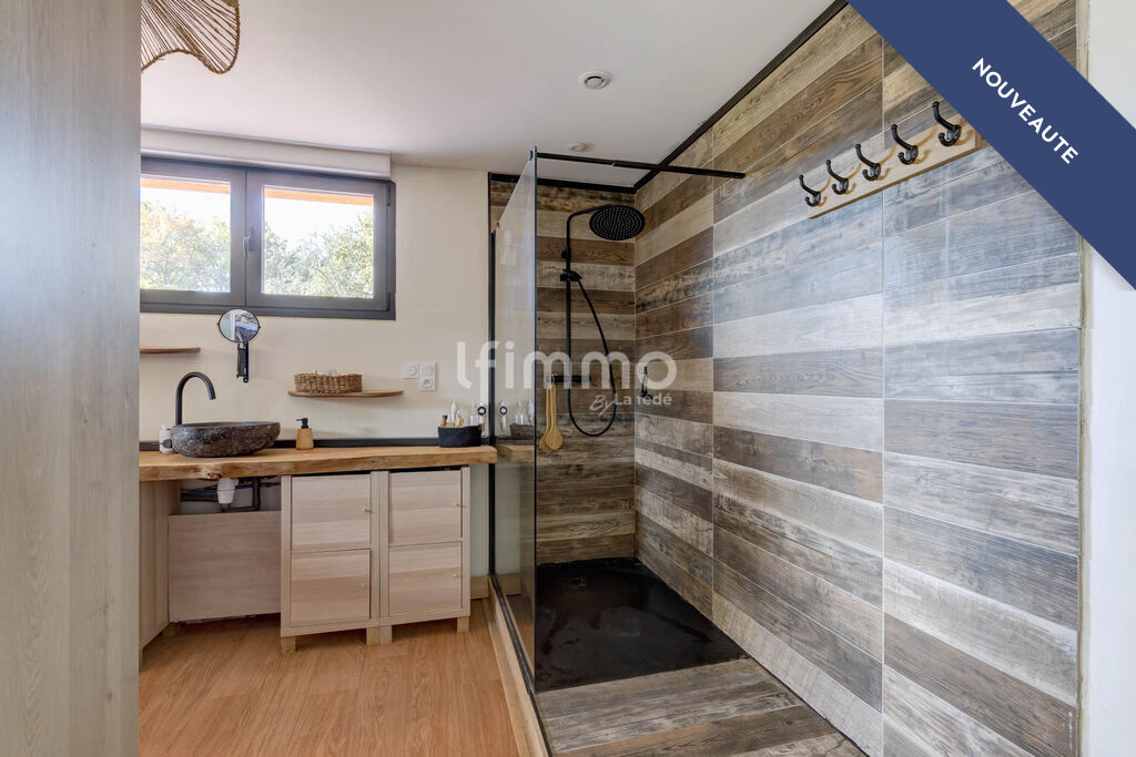 Modern bathroom Modern bathroom with walk-in shower and wood decor.