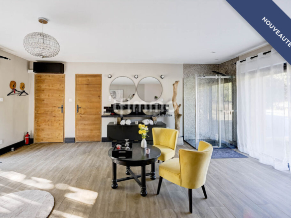 Interior of a modern house with living room, yellow armchairs and large windows.