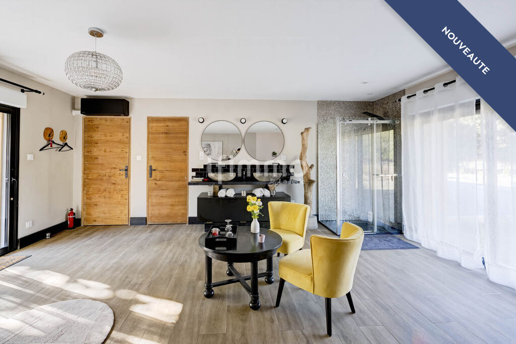 Interior of a modern property Interior of a modern house with living room, yellow armchairs and large windows.
