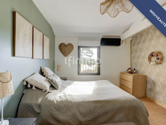 Room in a renovated property with a bed and modern decor.