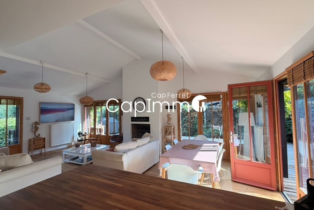 Interior of a villa in Lège-Cap-Ferret Interior of a bright villa in Lège-Cap-Ferret with living room, dining room and open kitchen.