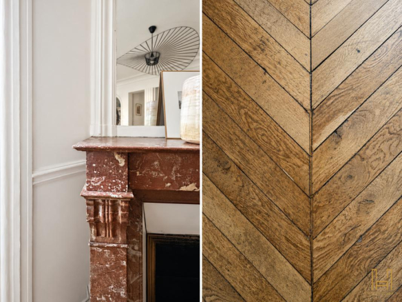 Details of a Haussmannian apartment in Paris: marble fireplace and herringbone parquet flooring.