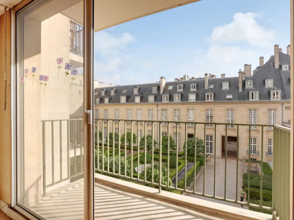 View from a balcony of an apartment overlooking gardens in a residence in the Marais district, Paris.