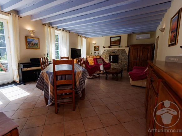 Interior of a Landes-style house with dining room and living room, natural light