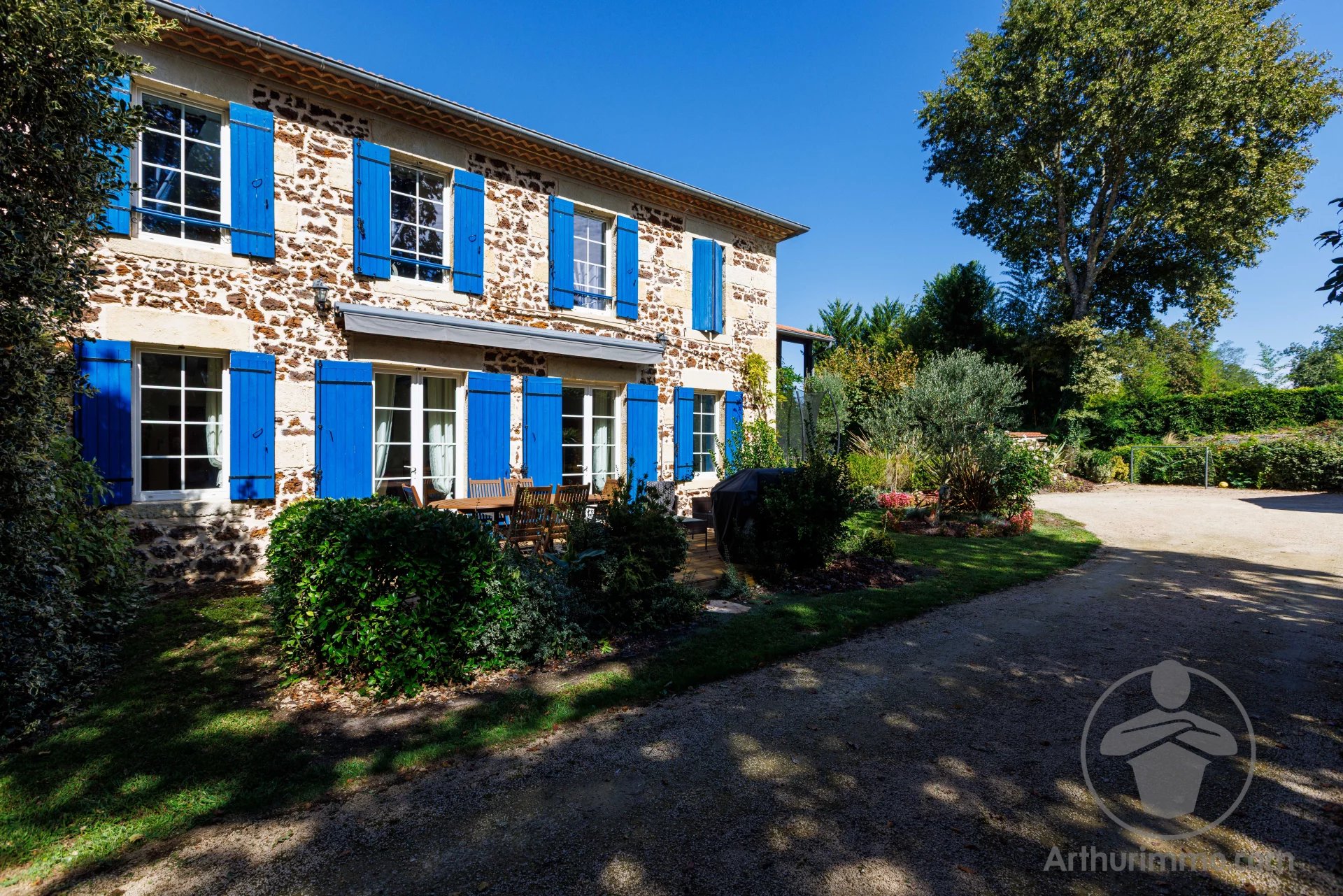 Character property in Liposthey Landes-style stone house with blue shutters, landscaped garden and independent cottages in Liposthey.