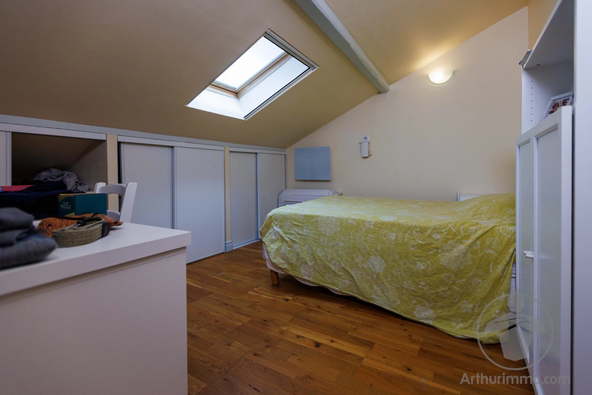 Attic room in a property in Liposthey Attic room with bed and storage in a character property in Liposthey.