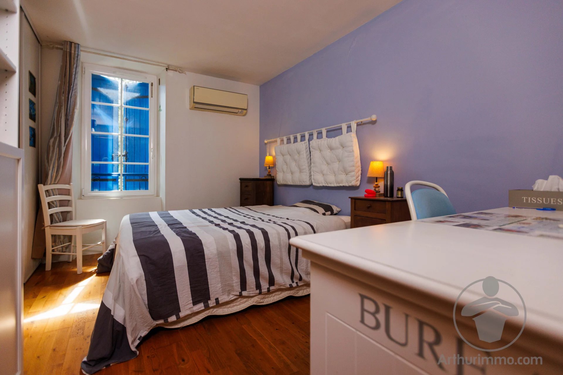 Bed and Breakfast Guest room with double bed and simple decor, window letting in light.