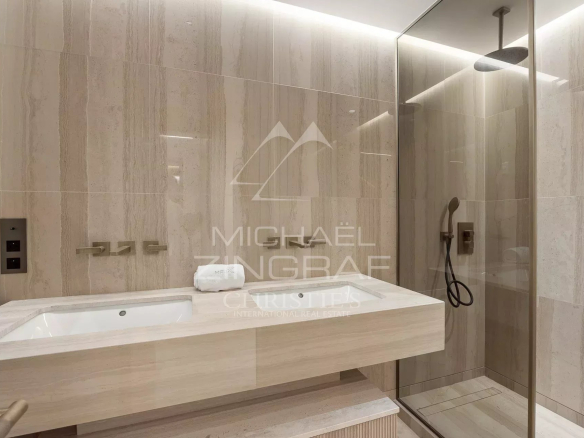 Modern bathroom with shower and sink in a luxury apartment in Cannes.