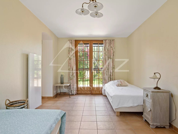 Room in a villa in Cap d'Antibes, with a single bed and bright windows.
