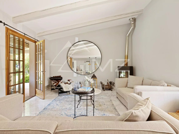 Interior of a modern villa with a bright living room and elegant furniture in Cap d'Antibes.