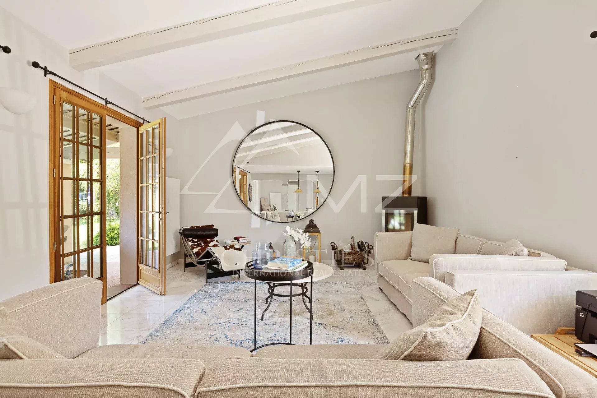 Living room of a villa in Cap d'Antibes Interior of a modern villa with a bright living room and elegant furniture in Cap d'Antibes.