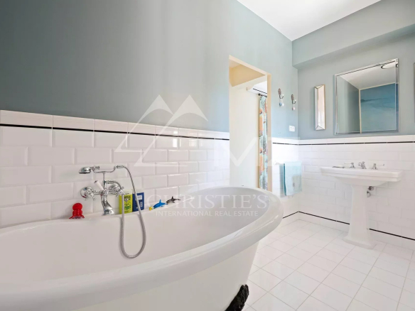 Bathroom of a villa in Cap d'Antibes with bathtub and sink.